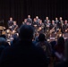 The U.S. Navy Band Commodores receive a standing ovation at James Benson Dudley High School during the 2023 National Tour