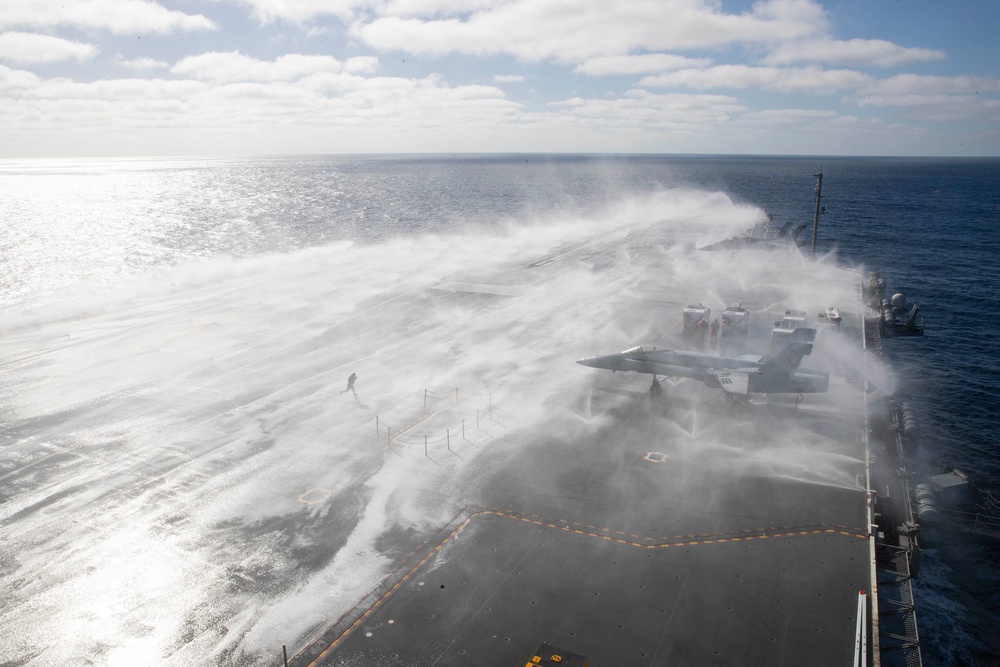 USS Abraham Lincoln conducts a countermeasure washdown