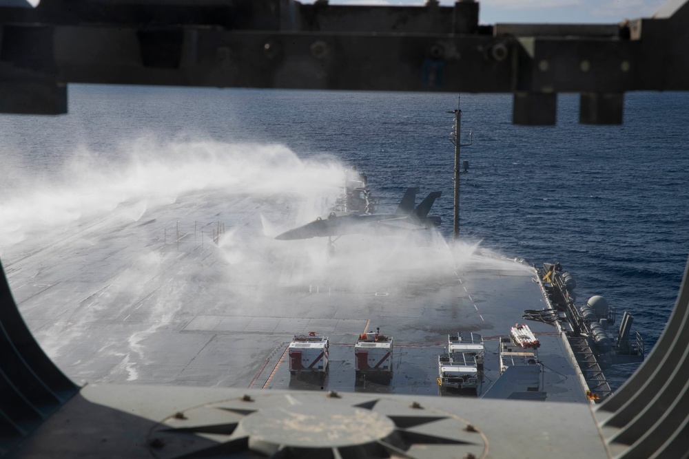 USS Abraham Lincoln conducts a countermeasure washdown