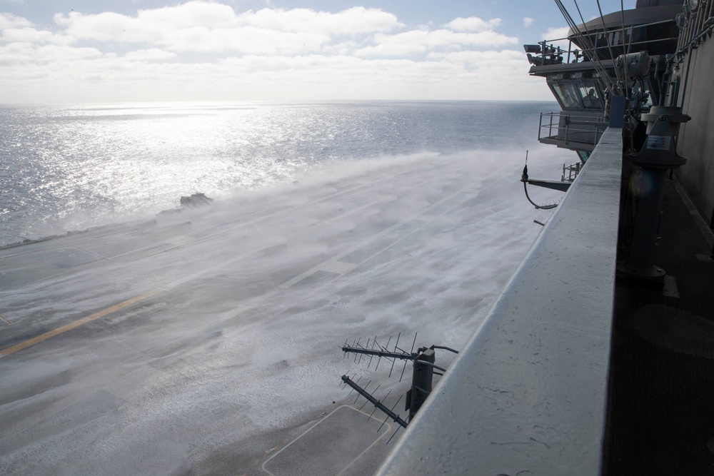 USS Abraham Lincoln conducts a countermeasure washdown