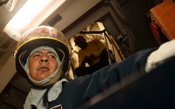 Sailors onboard USS Shoup participate in flooding drill