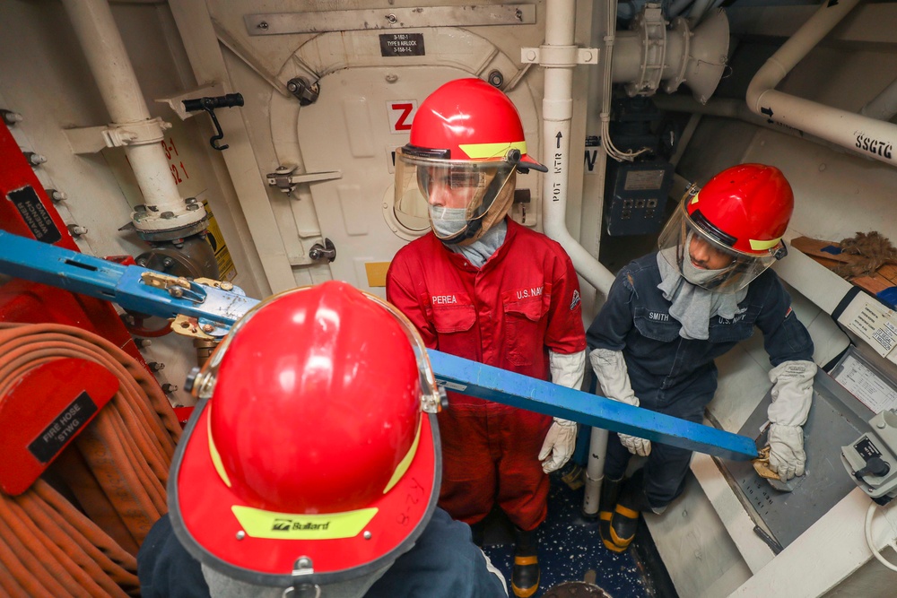 Sailors onboard USS Shoup participate in flooding drill