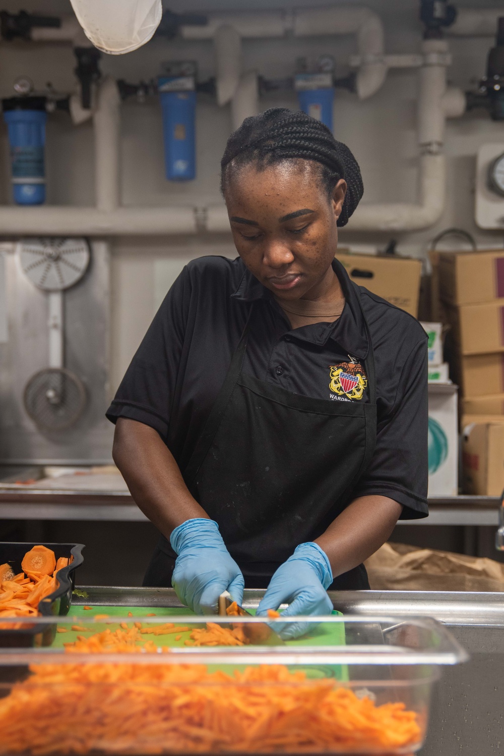 USS Ronald Reagan (CVN 76) Sailors prepare food in the galley