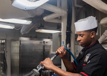 USS Ronald Reagan (CVN 76) Sailors prepare food in the galley