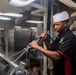 USS Ronald Reagan (CVN 76) Sailors prepare food in the galley