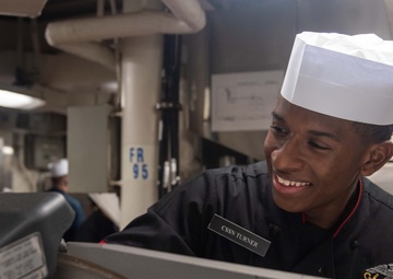USS Ronald Reagan (CVN 76) Sailors prepare food in the galley