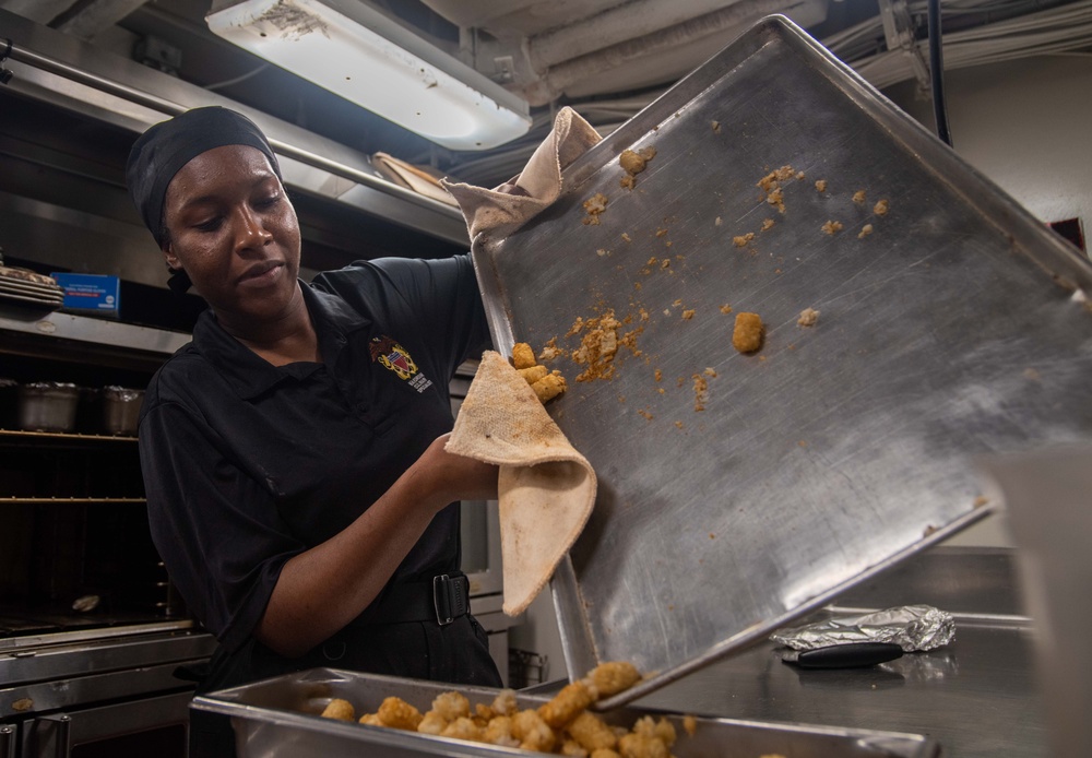 USS Ronald Reagan (CVN 76) Sailors prepare food in the galley