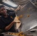 USS Ronald Reagan (CVN 76) Sailors prepare food in the galley