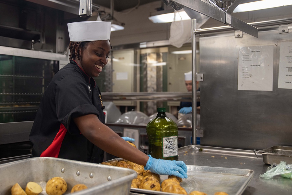 USS Ronald Reagan (CVN 76) Sailors prepare food in the galley