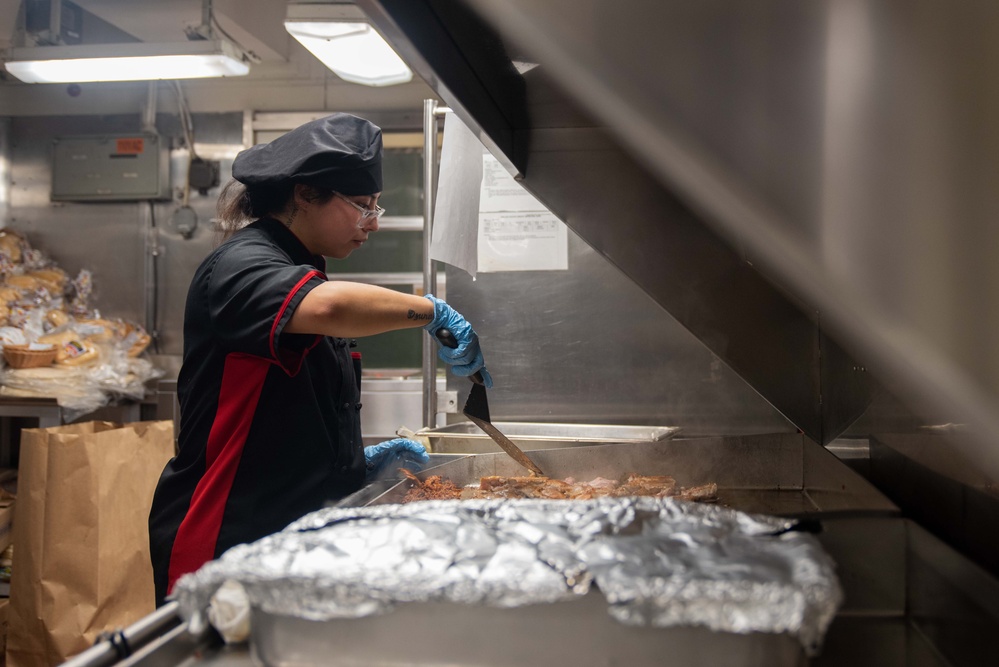 USS Ronald Reagan (CVN 76) Sailors prepare food in the galley