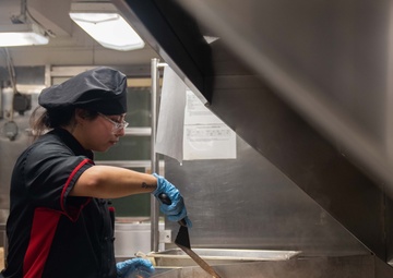 USS Ronald Reagan (CVN 76) Sailors prepare food in the galley