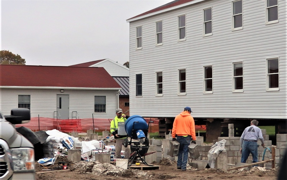 Work to build new foundations for relocated World War II-era barracks continues at Fort McCoy