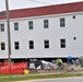 Work to build new foundations for relocated World War II-era barracks continues at Fort McCoy