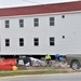 Work to build new foundations for relocated World War II-era barracks continues at Fort McCoy