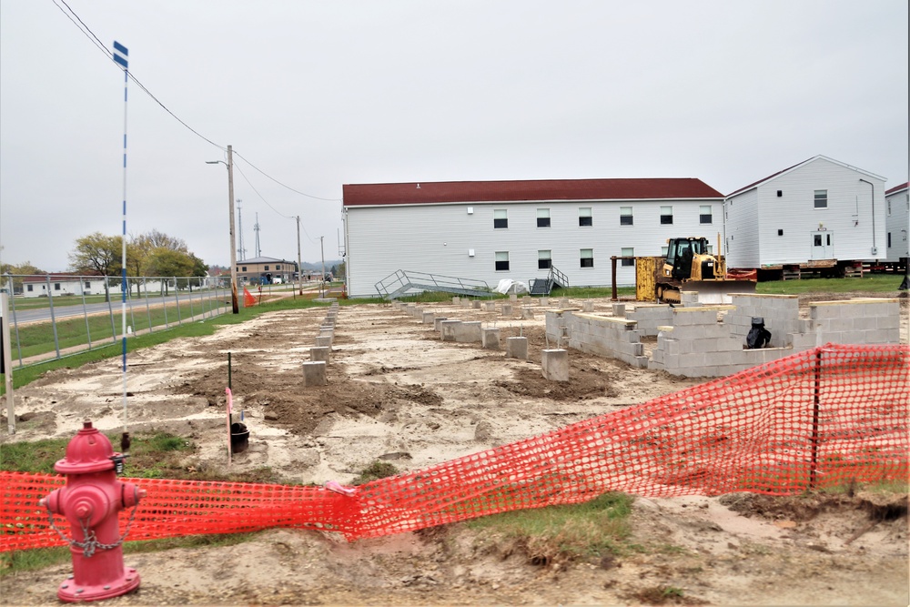 Work to build new foundations for relocated World War II-era barracks continues at Fort McCoy