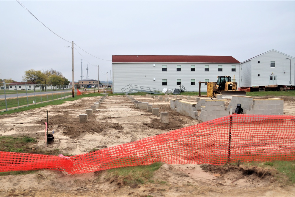 Work to build new foundations for relocated World War II-era barracks continues at Fort McCoy