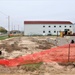 Work to build new foundations for relocated World War II-era barracks continues at Fort McCoy