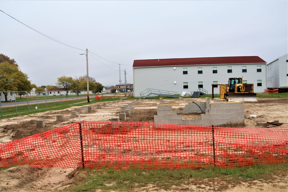 Work to build new foundations for relocated World War II-era barracks continues at Fort McCoy