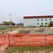 Work to build new foundations for relocated World War II-era barracks continues at Fort McCoy