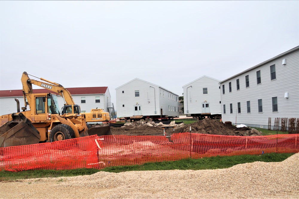 Work to build new foundations for relocated World War II-era barracks continues at Fort McCoy