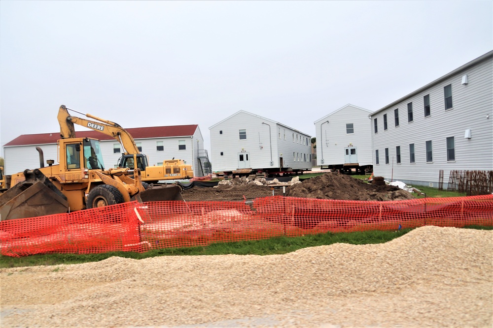 Work to build new foundations for relocated World War II-era barracks continues at Fort McCoy