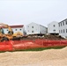 Work to build new foundations for relocated World War II-era barracks continues at Fort McCoy