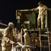 The 10th Mountain Division Sustainment Brigade help distribute water outside of the Watertown Municipal Arena to residents of Watertown, New York.