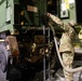 The 10th Mountain Division Sustainment Brigade help distribute water outside of the Watertown Municipal Arena to residents of Watertown, New York.