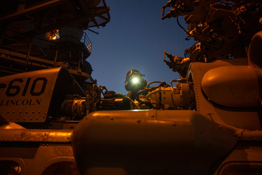 HSC 14 Sailor performs routine maintenance