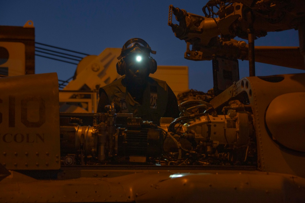 HSC 14 Sailor performs routine maintenance