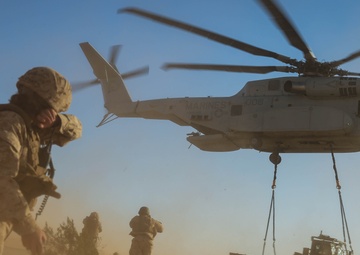 Helicopters perform an external lift