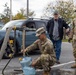 The 10th Mountain Division Sustainment Brigade help distribute water outside of the Watertown Municipal Arena to residents of Watertown, New York.