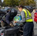 The 10th Mountain Division Sustainment Brigade help distribute water outside of the Watertown Municipal Arena to residents of Watertown, New York.