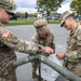 The 10th Mountain Division Sustainment Brigade 548th Combat Sustainment Support Battalion help distribute water outside of the Watertown Municipal Arena to residents of Watertown, New York.