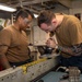 USS Ronald Reagan (CVN 76) Sailors perform maintenance