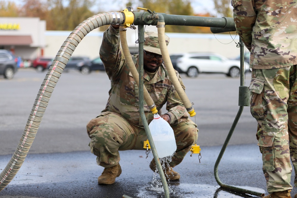 The 10th Mountain Division Sustainment Brigade helps distribute water to residents of Watertown, New York.