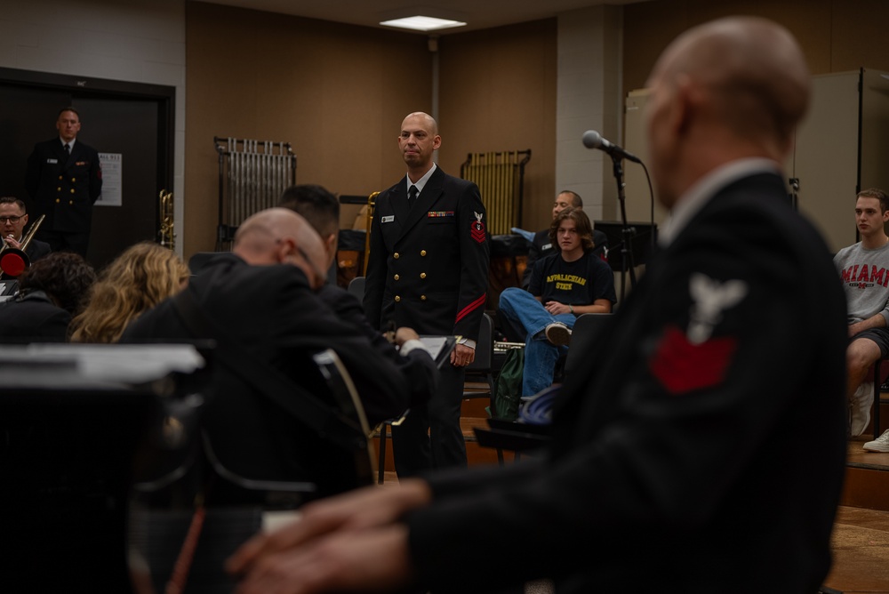 Chief Musician Jon Barnes rehearses the band at Elon University