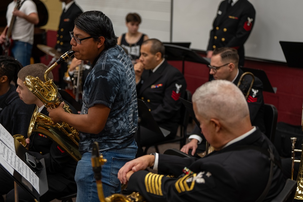 Senior Chief Musician Rob Holmes works with a young soloist at Elon University