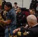 Senior Chief Musician Rob Holmes works with a young soloist at Elon University