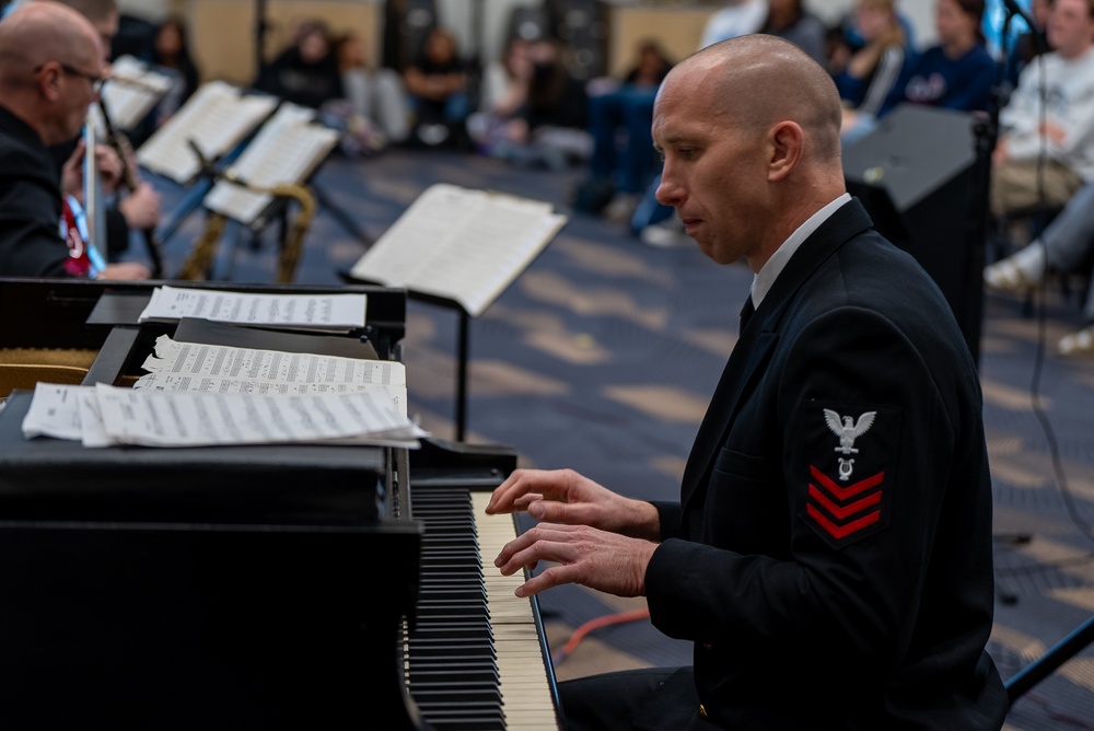 Musician 1st Class Ryan Hanseler performs a piano solo at Spartanburg Highschool