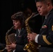 Musician 1st Class Amanda Ballantine and Chief Musician Andrew Francisco performs a dueling Sax solo