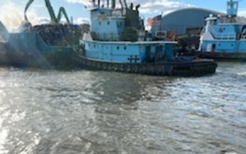 - Crewmembers aboard the Paul Andrew and James Charles tugs fight a scrap metal fire aboard a barge