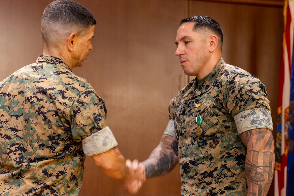 Staff Sgt. Jairo Echeverry receives Navy and Marine Corps Commendation Medal