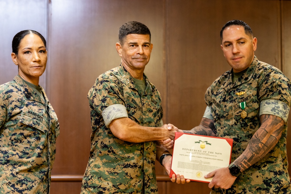 Staff Sgt. Jairo Echeverry receives Navy and Marine Corps Commendation Medal