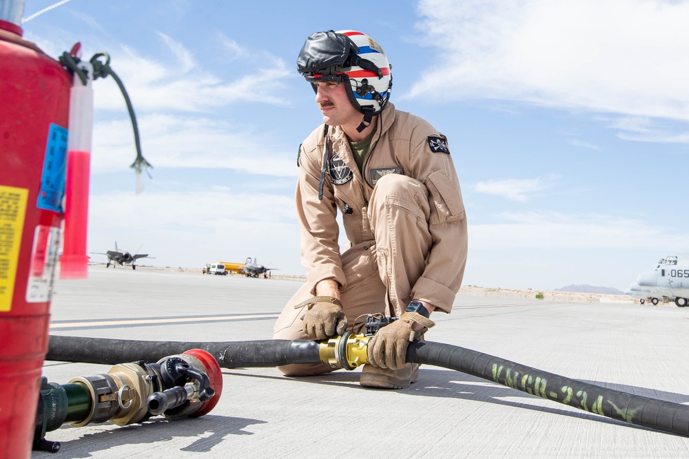 U.S. Marines perform an air delivery ground refueling on F/A-18 Hornet aircraft