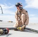 U.S. Marines perform an air delivery ground refueling on F/A-18 Hornet aircraft