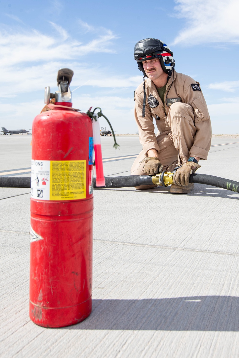 U.S. Marines perform an air delivery ground refueling on F/A-18 Hornet aircraft