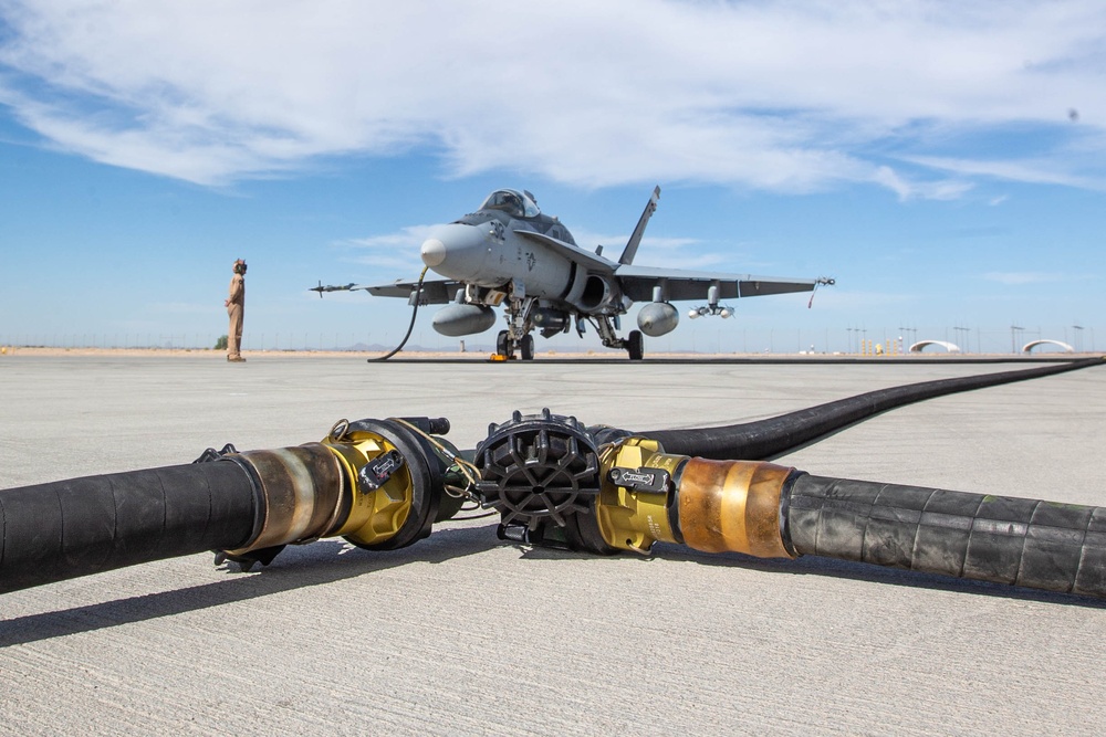 U.S. Marines perform an air delivery ground refueling on F/A-18 Hornet aircraft