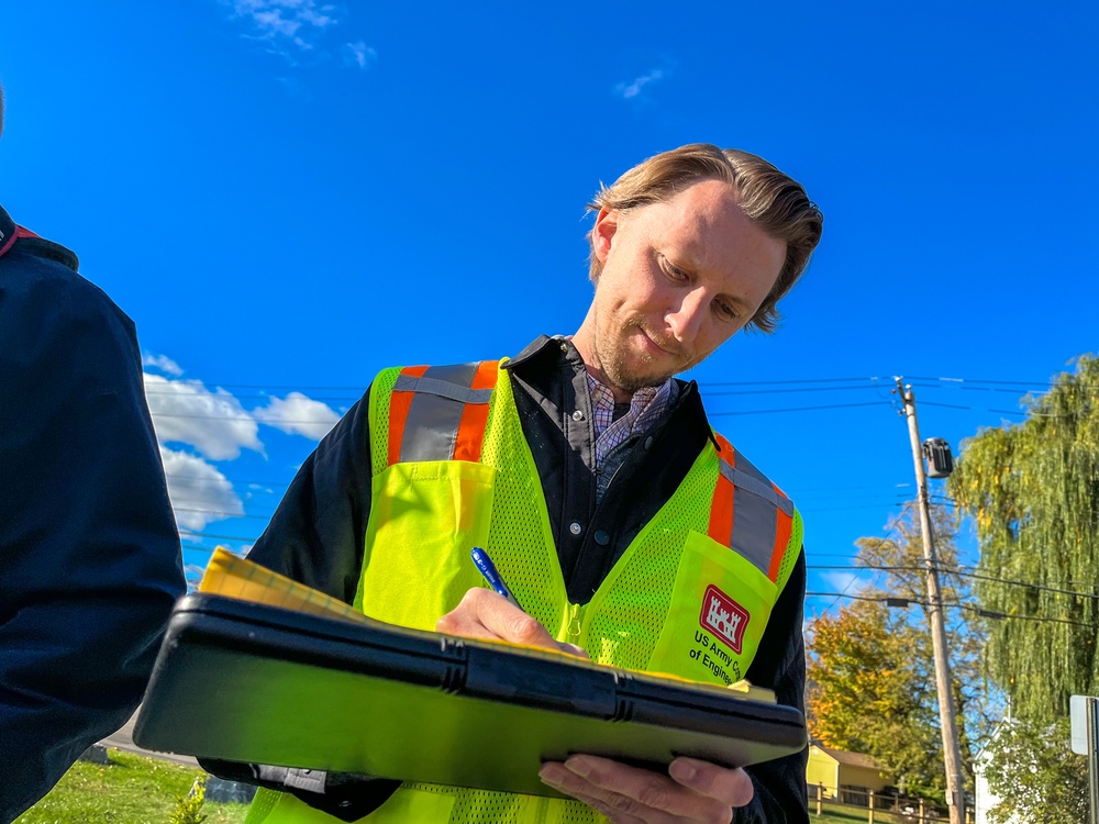 U.S. Army Corps Engineer taking notes in the field