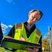 U.S. Army Corps Engineer taking notes in the field